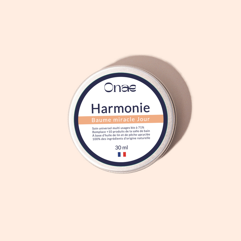 Pot de baume réparateur de jour Onaé Harmonie, soin naturel multi-usages pour peau sensible, formule concentrée à base d'actifs végétaux, packaging beige et bleu.
